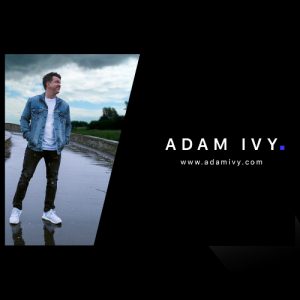 Adam Ivy standing on a wet road in a denim jacket beside his name and website