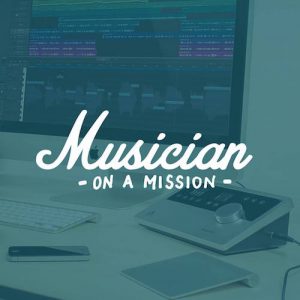 Musician on a Mission podcast logo over a desk with an audio interface and keyboard